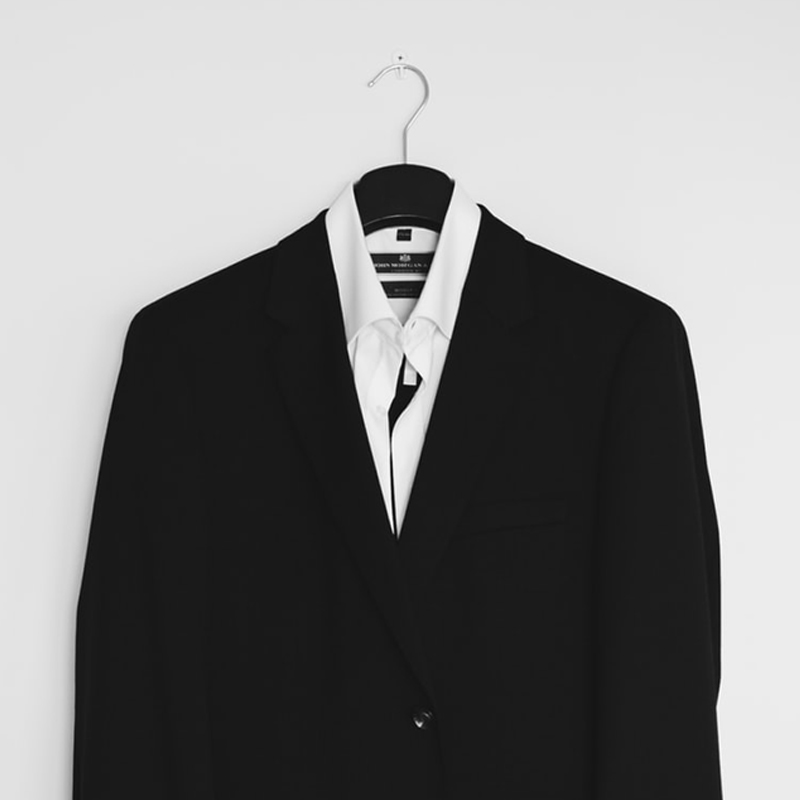 Business suit and shirt on a hanger
